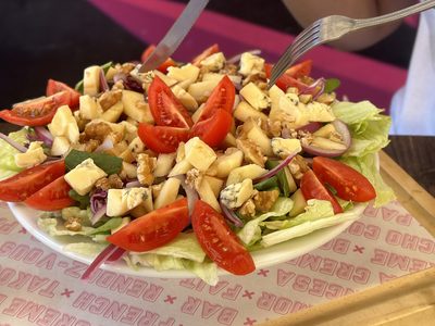 Salad with cherry tomatoes, cheese and walnuts